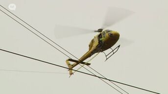 Helikopter plaatst hoogspanningskabels op masten in Riemst